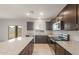 Kitchen featuring an island, stainless steel appliances, and a sliding glass door at 42950 W Palo Amarillo Rd, Maricopa, AZ 85138