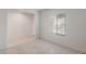 Empty bedroom with neutral carpet, natural light, and a window overlooking the backyard at 42955 W Palo Amarillo Rd, Maricopa, AZ 85138
