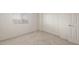 Cozy carpeted bedroom with a window and large closet offers a relaxing space at 42955 W Palo Amarillo Rd, Maricopa, AZ 85138
