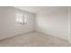 Bright, carpeted bedroom with natural light and ample space for a relaxing retreat at 42955 W Palo Amarillo Rd, Maricopa, AZ 85138