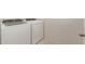 Modern laundry room features a new washer and dryer at 42955 W Palo Amarillo Rd, Maricopa, AZ 85138