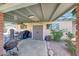 Cozy back patio area with comfortable seating, a ceiling fan, and views of the surrounding greenery at 4418 W Palo Verde Ave, Glendale, AZ 85302