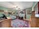 Bedroom with a daybed, wood furniture, and an colorful accent rug at 4418 W Palo Verde Ave, Glendale, AZ 85302
