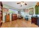 Comfortable living area with hardwood floors, natural light, and traditional furnishings creating a welcoming atmosphere at 4418 W Palo Verde Ave, Glendale, AZ 85302