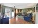 Cozy living room with warm wood floors and a comfortable seating area at 4418 W Palo Verde Ave, Glendale, AZ 85302