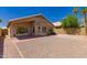 This property features a cozy backyard with desert landscaping and a covered patio, ideal for outdoor relaxation at 4526 E Bannock St, Phoenix, AZ 85044