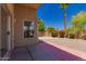 An inviting backyard retreat with a covered patio and vibrant desert flora to create a peaceful outdoor haven at 4526 E Bannock St, Phoenix, AZ 85044