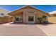 Desert landscaped backyard featuring covered patio and sliding glass doors, perfect for relaxation at 4526 E Bannock St, Phoenix, AZ 85044