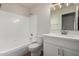 Full bathroom with a tub/shower combo, single sink vanity, and white fixtures at 4526 E Bannock St, Phoenix, AZ 85044