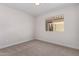 Bright bedroom with carpet, window, and ample natural light, offering a cozy feel at 4526 E Bannock St, Phoenix, AZ 85044