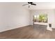 Bedroom with hard surface flooring and glass doors leading to the backyard at 4526 E Bannock St, Phoenix, AZ 85044