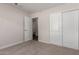Bedroom with closet doors and an adjacent bathroom with an open entry for easy access at 4526 E Bannock St, Phoenix, AZ 85044