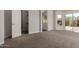 Spacious bedroom with carpet flooring, a walk-in closet, an en-suite bathroom, and large windows at 4526 E Bannock St, Phoenix, AZ 85044
