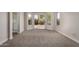 Bedroom featuring carpet floors, sliding glass door with backyard views, and a view of the bathroom at 4526 E Bannock St, Phoenix, AZ 85044
