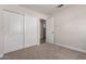 Bedroom with a large closet and an open door to another room in neutral tones at 4526 E Bannock St, Phoenix, AZ 85044