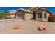 Charming home exterior showcasing a well-kept landscape with a gravel front yard at 4526 E Bannock St, Phoenix, AZ 85044