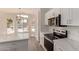 Eat-in kitchen with stainless steel appliances, stone countertops, and lots of natural light at 4526 E Bannock St, Phoenix, AZ 85044