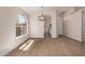 Open floor plan with wood floors, recessed lighting, chandelier, arched windows, and neutral paint at 4526 E Bannock St, Phoenix, AZ 85044