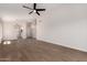 Spacious living room featuring hard surface flooring and modern ceiling fan at 4526 E Bannock St, Phoenix, AZ 85044