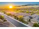 Aerial view of desert homes with beautiful mountain views at sunrise at 5626 E Sleepy Ranch Rd, Cave Creek, AZ 85331