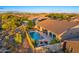 Aerial view of a private backyard with pool, privacy fence, patio furniture, and well-kept landscaping at 5626 E Sleepy Ranch Rd, Cave Creek, AZ 85331