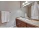 Well-lit bathroom featuring a single sink, mirror, and sleek brown cabinetry at 5626 E Sleepy Ranch Rd, Cave Creek, AZ 85331