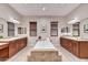 Luxurious bathroom with a soaking tub, double vanities, elegant fixtures, and natural lighting at 5626 E Sleepy Ranch Rd, Cave Creek, AZ 85331