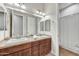 Bathroom featuring double sinks, spacious countertop, and shower with curtain at 5626 E Sleepy Ranch Rd, Cave Creek, AZ 85331