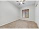 Clean bedroom featuring neutral carpet and window with privacy blinds at 5626 E Sleepy Ranch Rd, Cave Creek, AZ 85331