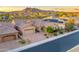 A desert home with solar panels, a three-car garage and desert landscaping at 5626 E Sleepy Ranch Rd, Cave Creek, AZ 85331