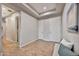 Hallway boasts tray ceilings, neutral paint, beautiful tile floors, and access to the kitchen and other areas at 5626 E Sleepy Ranch Rd, Cave Creek, AZ 85331