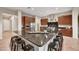 Beautiful kitchen showcasing a large island with seating, stainless steel appliances, and modern cabinetry at 5626 E Sleepy Ranch Rd, Cave Creek, AZ 85331