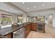 Open concept kitchen featuring granite countertops, a wine fridge, stainless steel appliances, and tile flooring at 5626 E Sleepy Ranch Rd, Cave Creek, AZ 85331