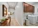 Bright laundry room boasts ample storage with built-in cabinets and modern washer and dryer at 5626 E Sleepy Ranch Rd, Cave Creek, AZ 85331