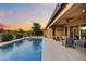 Outdoor patio with seating and a pool view, creating a perfect retreat at 5626 E Sleepy Ranch Rd, Cave Creek, AZ 85331