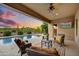 Covered patio with a view of the pool, desert landscape, and seating at 5626 E Sleepy Ranch Rd, Cave Creek, AZ 85331