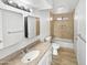 Updated bathroom featuring a large mirror, tub, and updated fixtures at 5918 S Parkside Dr, Tempe, AZ 85283