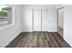 Inviting bedroom featuring updated flooring and closet with sliding doors at 5918 S Parkside Dr, Tempe, AZ 85283