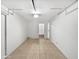 Spacious garage with painted walls and tile flooring, ready for customization at 5918 S Parkside Dr, Tempe, AZ 85283