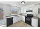 Bright kitchen features white cabinets, granite countertops, and modern appliances at 5918 S Parkside Dr, Tempe, AZ 85283