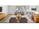 Bright living room with modern furniture, light wood floors and a large window at 5918 S Parkside Dr, Tempe, AZ 85283