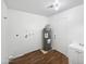 Utility room with water heater, sink, cabinet and washer/dryer hook-ups at 5918 S Parkside Dr, Tempe, AZ 85283