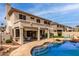 Inviting backyard features a sparkling pool, covered patio, and lush landscaping, perfect for outdoor entertaining at 5993 W Topeka Dr, Glendale, AZ 85308