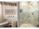 Stylish bathroom with a glass shower door and decorative wall tiles, plus themed wall decorations at 5993 W Topeka Dr, Glendale, AZ 85308