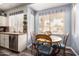 Bright dining area with wood floors and a picturesque window view at 5993 W Topeka Dr, Glendale, AZ 85308