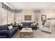 Bright living room with plush sofas, neutral decor, and large windows with blinds at 5993 W Topeka Dr, Glendale, AZ 85308