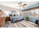 Comfortable main bedroom with a spacious layout and fan at 5993 W Topeka Dr, Glendale, AZ 85308