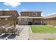 A backyard including green lawn, shaded patio, and modern design at 6338 W Raymond St, Phoenix, AZ 85043