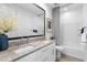 Stylish bathroom features a double sink vanity with granite countertops and modern fixtures at 6338 W Raymond St, Phoenix, AZ 85043