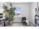 Inviting bedroom features a cozy reading nook with a view, creating a peaceful retreat at 6338 W Raymond St, Phoenix, AZ 85043